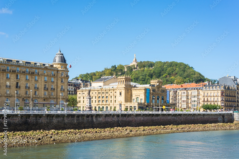 View across the river Urumea to the Victoria Eugenia Theater, a neoplateresque building, a special Spanish architecture, in Donostia San Sebastian. 