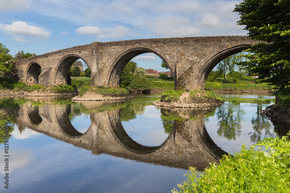The stone bridge in Stirling reflecting in the river Forth