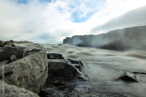 Dirty river flow. Dettifoss waterfall in Iceland.