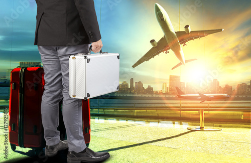business man and breifcase ,traveling luggage standing in airpor photo