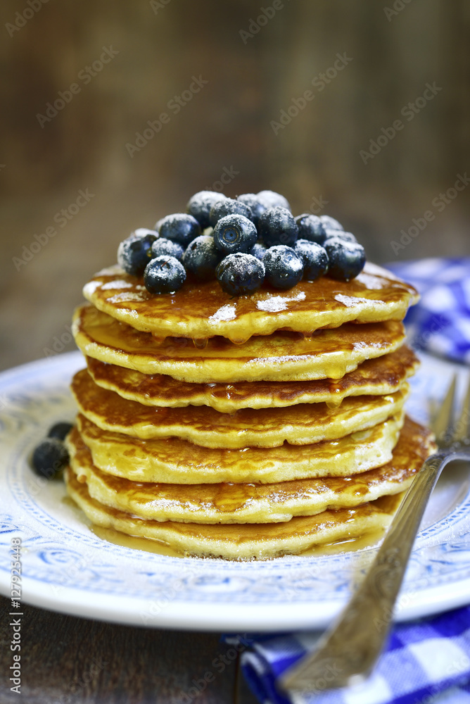 Pancakes with honey and blueberry.Top view. Pancakes with honey and blueberry.Top view.