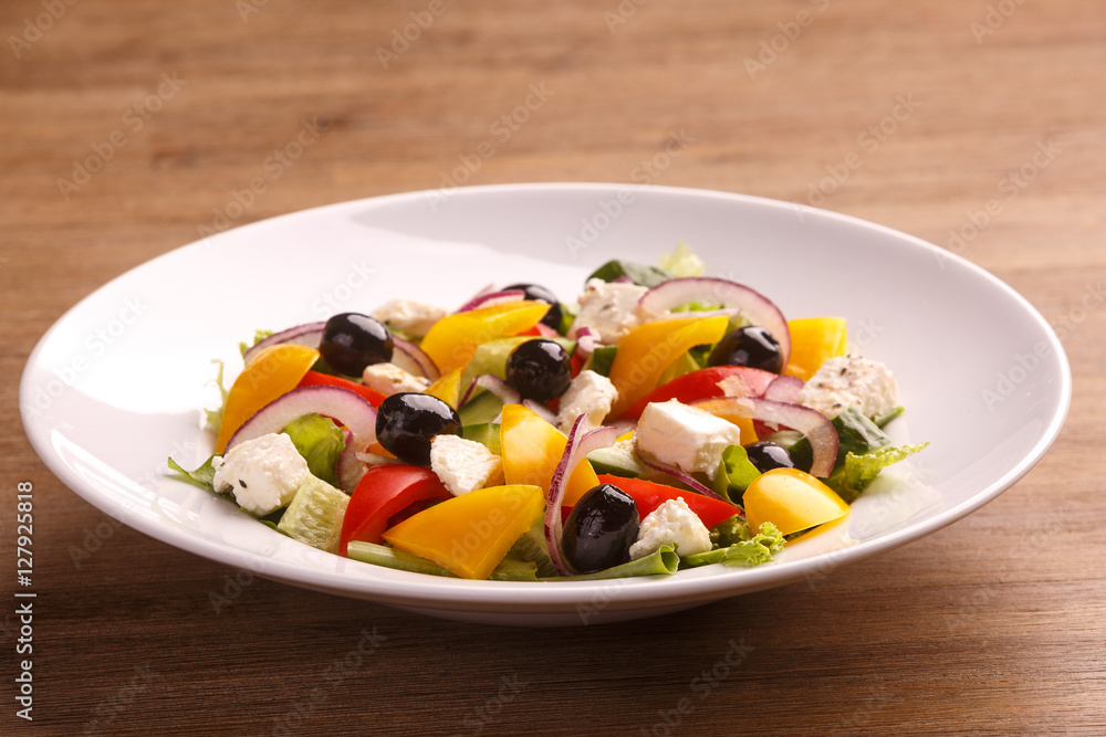 Freshly maked Greek salad with olive, cheese and vegetables Freshly maked Greek salad with olive, cheese and vegetables