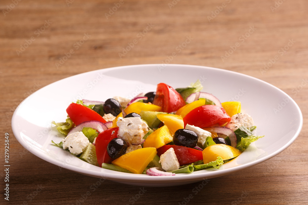 Freshly maked Greek salad with olive, cheese and vegetables