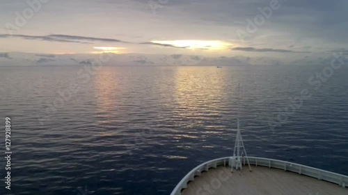 Sunrise over Brabant Island, Gerlache Strait, Antarctica. Brabant island is the second largest island in the Palmer Archipelago. Large ice-cliffs protect its coastline from the sea. photo