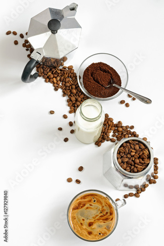 Coffee beans and ground, milk in a bottle, Moka pot