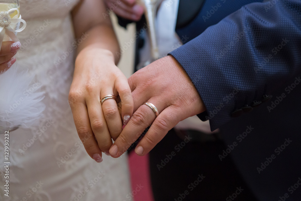 bride and groom show their wedding rings bride and groom show their wedding rings