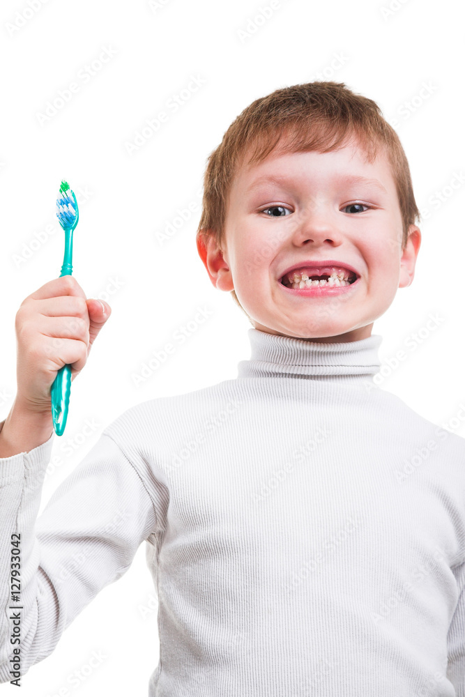 Boy without baby teeth with toothbrush