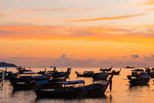 Wooden fisherman boat with sky background on sunrise