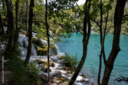 Waterfall and turquoise pond in the forest. Plitvice Lakes in National Park in Croatia. © Joanna
