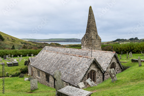 The Church of St Enodoc is located amongst sand dunes adjacent to the Cornish village of Trebetherick.