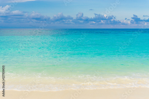 Tropical sea beach blue sky sand sun daylight
