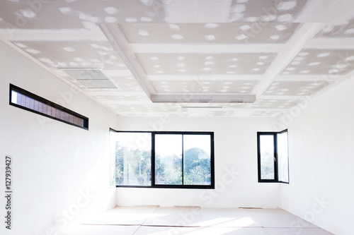Empty room interior build gypsum board ceiling and Air conditioner in construction site