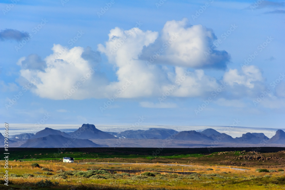 Fototapeta premium Landscape with highway and icelandic mountain range