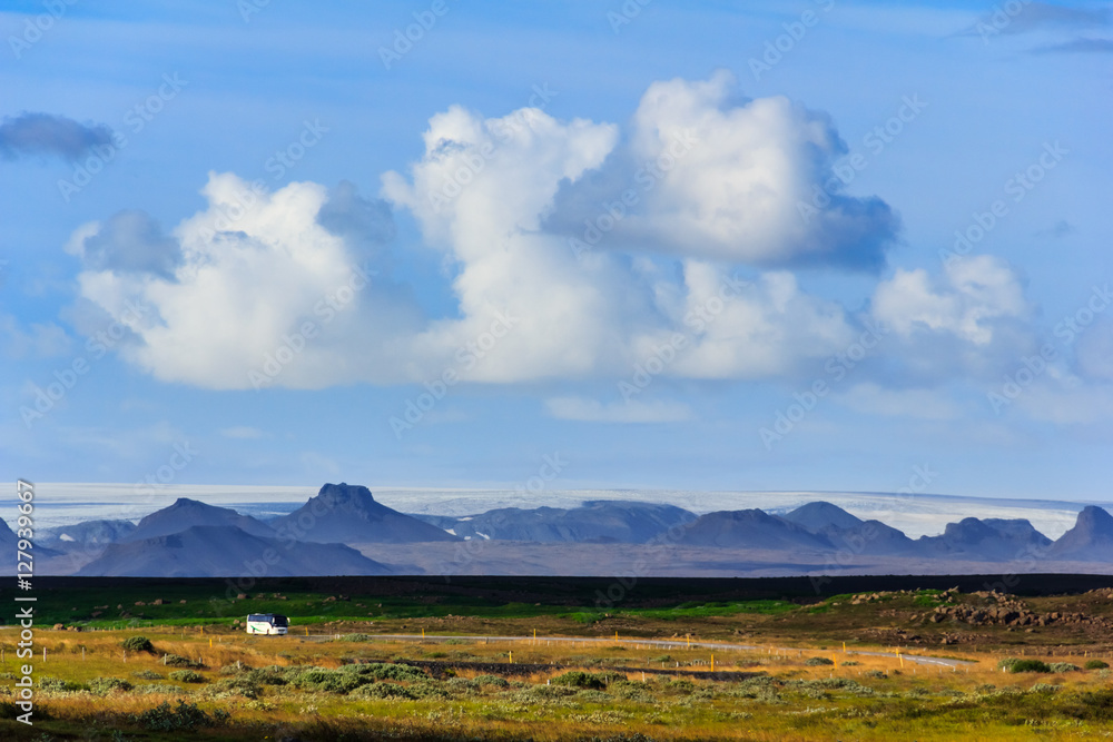 Landscape with highway and icelandic mountain range