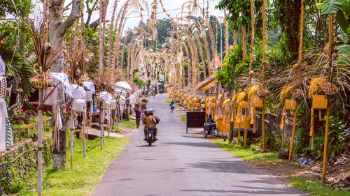 Bali Penjors, decorated bamboo poles along the village street in Sideman, Indonesia. photo