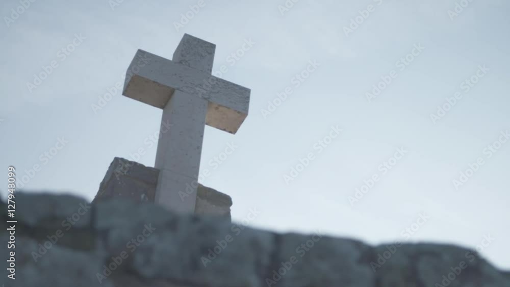 Stone catholic cross in the sky. Ancient religion building for catholic. Religious monument at Cabo Da roca, Portugal. Stone catholic cross in the sky. Ancient religion building for catholic. Religious monument at Cabo Da roca, Portugal.