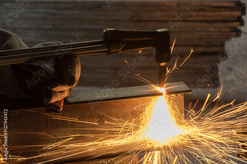 Worker metal Cutting With acetylene welding cutting torch