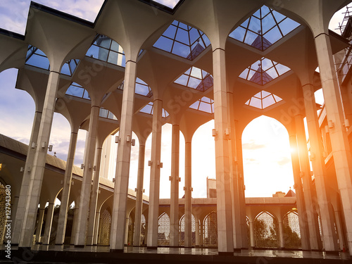 Minarets of Sultan Salahuddin Abdul Aziz Mosque, Shah Alam, Selangor, Malaysia - Evening sunlight through the mosque photo