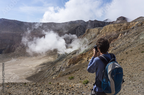 Backpacker near the crater of Egon volcano, Flores, Indonesia