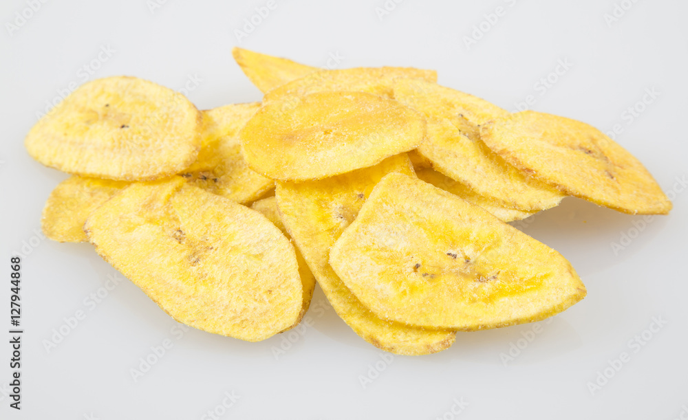 Green banana fried on a neutral background Green banana fried on a neutral background