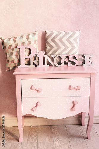 girls pink chest of drawers dresser with pillows photo