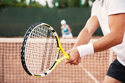 Cropped image of tennis man © Drobot Dean