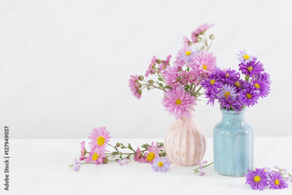 flowers in ceramic vases on white background flowers in ceramic vases on white background