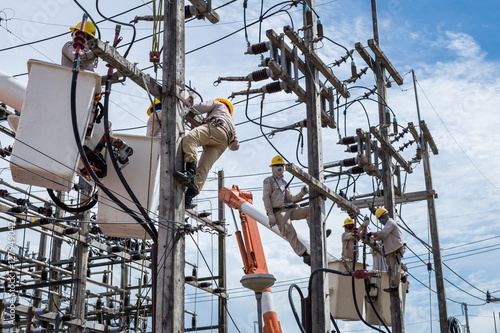 electrician repair the transmission system.