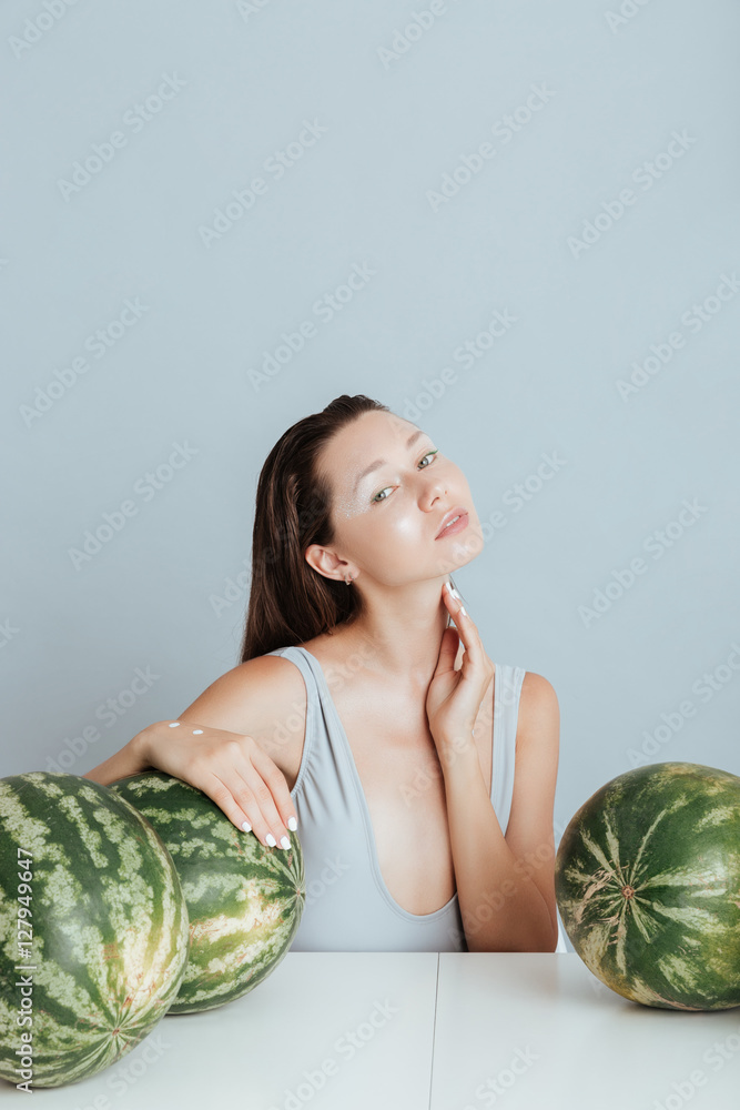 Portrait of sensual young woman with fresh watermelons Portrait of sensual young woman with fresh watermelons