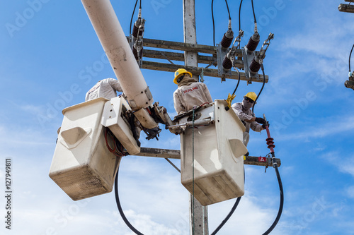 electrician repair the transmission system.