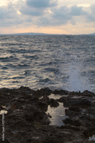 Water splashing on rocks coast. Sea background. © yolandaalemany