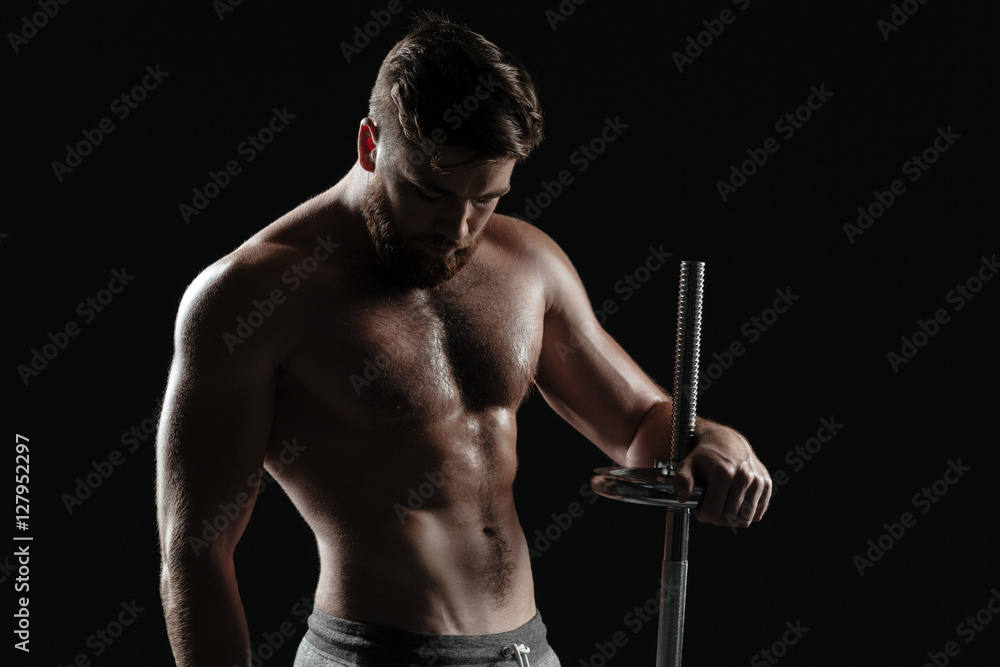 Photo of naked athletic man with barbell Photo of naked athletic man with barbell