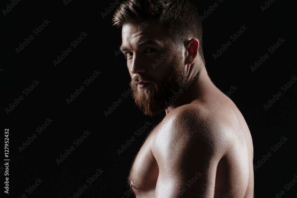 Side view of naked strong man