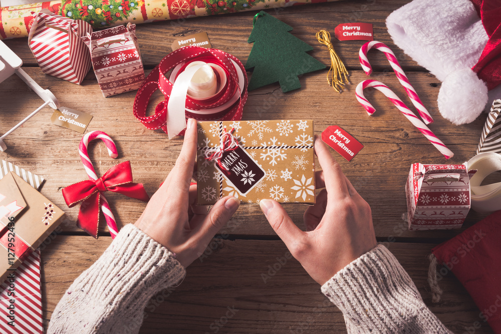 Fototapeta premium Preparing a Christmas gift for friends.