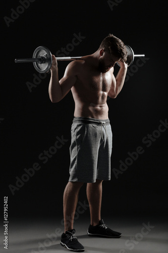 Photo of strong man with barbell