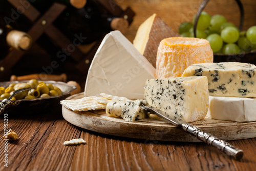 Canvas Print Mix cheese on wooden board.