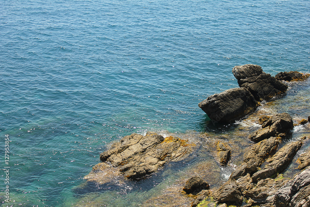 view of the sea and rocks from above