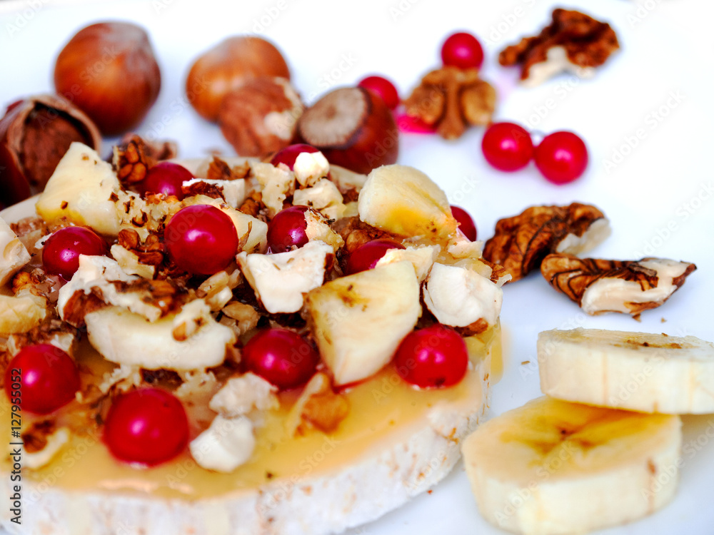 Sweet rice cakes with honey, nuts, banana and berry viburnum Sweet rice cakes with honey, nuts, banana and berry viburnum