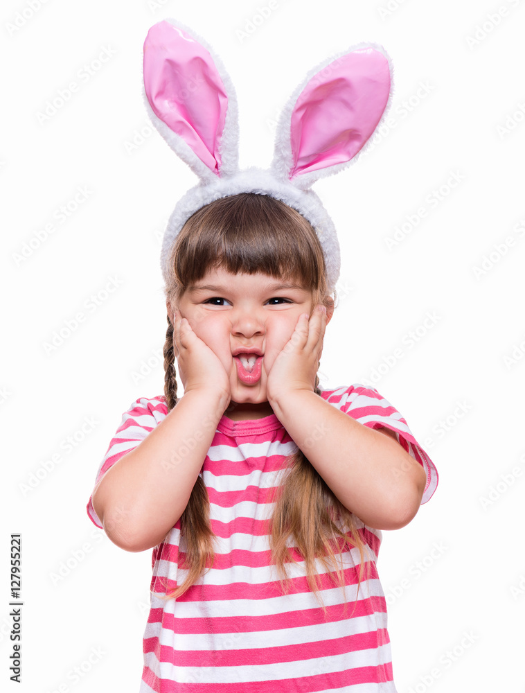 Happy little girl with pink rabbit ears. Portrait of cute caucasian baby wearing bunny ears. Funny preschool child, isolated on white background. Healthy carefree kid - Easter holidays concepts. Happy little girl with pink rabbit ears. Portrait of cute caucasian baby wearing bunny ears. Funny preschool child, isolated on white background. Healthy carefree kid - Easter holidays concepts.