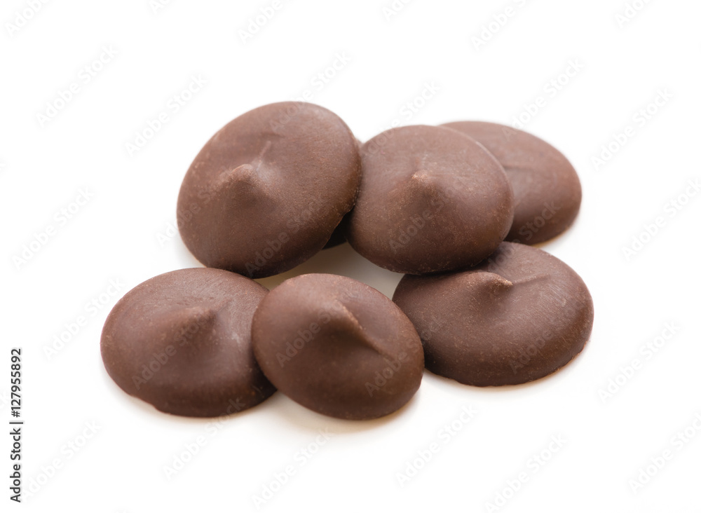 Dark chocolate chips isolated on white background Dark chocolate chips isolated on white background