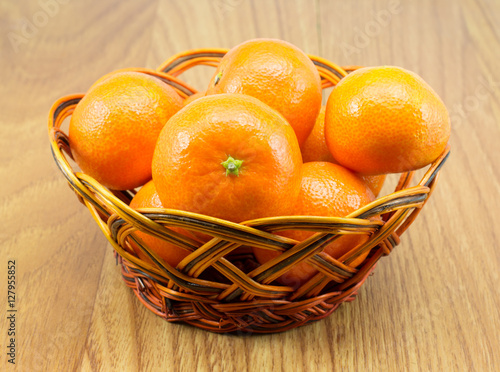 Ripe tangerines in the wicker basket