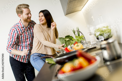 Young couple preparing meal