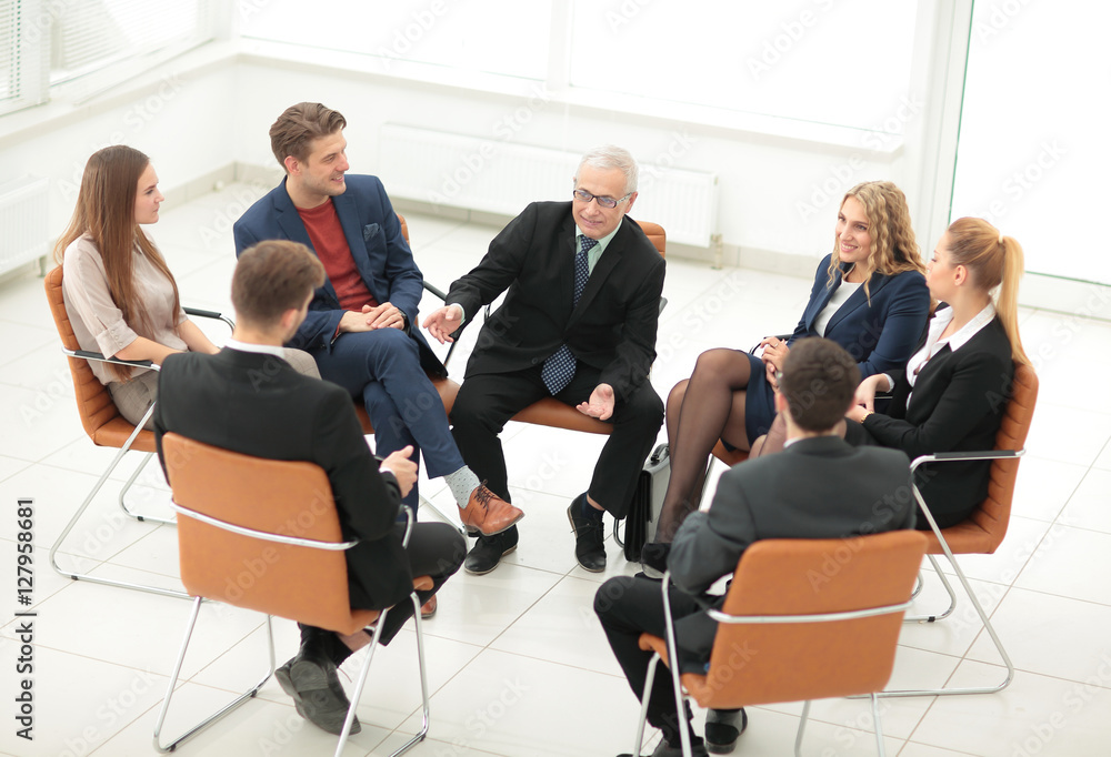 The boss meets with employees of the company