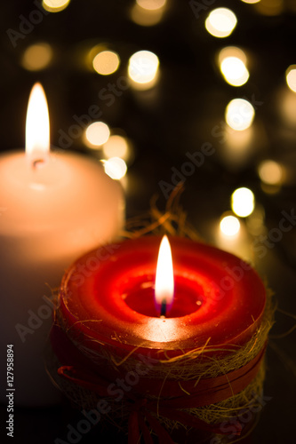 Red and white Christmas candle and Christmas light   © chandlervid85