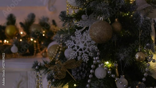 Beautiful toys on a Christmas tree. Camera movement from the bottom up.