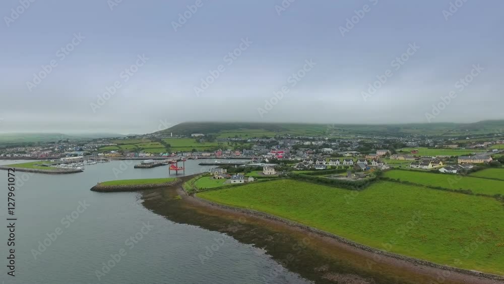Aerial shot of the small village of Dingle. County Kerrys Dingle Peninsula is one of Irelands most beautiful coastal regions. in Ireland Aerial shot of the small village of Dingle. County Kerrys Dingle Peninsula is one of Irelands most beautiful coastal regions. in Ireland