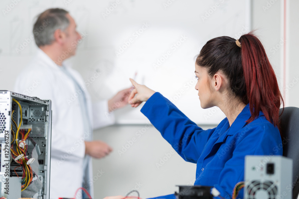 image of engineer woman pointing out board image of engineer woman pointing out board