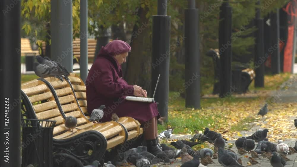 Grandma is typing on a laptop surrounded by pigeons and sparrows. Slow motion.
Grandma uses a laptop at park. To it flocked many pigeons and sparrows. Grandma is typing on a laptop surrounded by pigeons and sparrows. Slow motion.
Grandma uses a laptop at park. To it flocked many pigeons and sparrows.