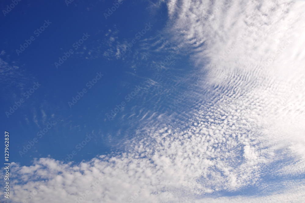 White clouds on the blue sky ripple