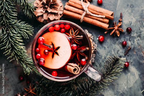 Mulled wine with cowberry, cinnamon, apple and anise. Christmas or New Year drink. Top view and copy space.